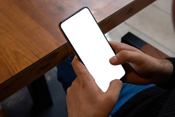 Mockup Image Man Holding Smartphone Blank White Screen While Sitting — Stock Photo, Image