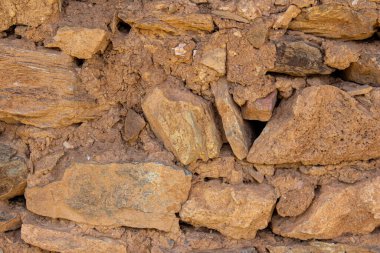 Old mud brick wall texture background. Abandoned house wall.