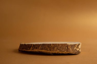 Wooden showcase on color background. Presentation podium for perfume and cosmetic products. Front view.