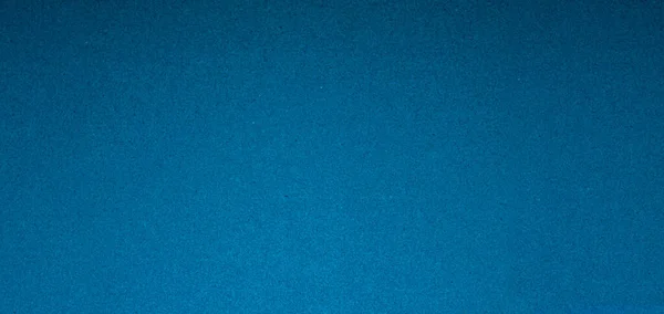 Blue paper texture background. Craft paper surface for designs. Blank backdrop with copy space.