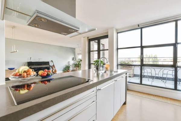 Interior of spacious light kitchen with modern furniture — Stock Photo, Image