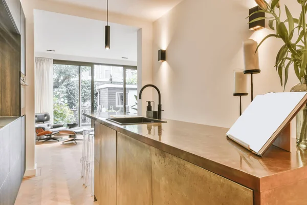 Rectangular kitchen with dark kitchen unit and countertop — 스톡 사진