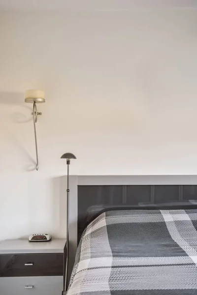 Cozy bedroom with a comfortable bed — стоковое фото