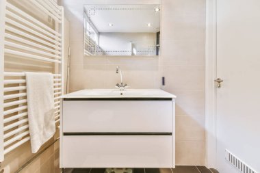 Delightful bathroom with large rectangular mirror