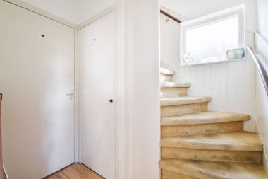 Elite staircase with beige carpet