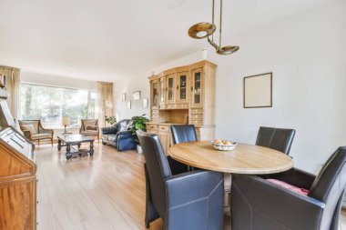 Lovely dining room with wooden round table