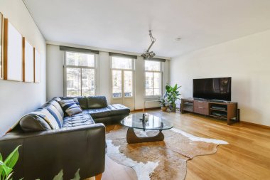 Luxurious living room with black sofa