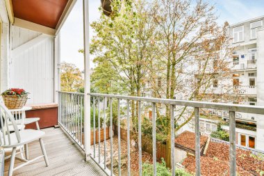 Graceful balcony with a unique view of multi-storey houses