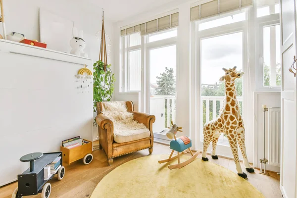 Luxurious childrens room with toys and a yellow rug — Fotografia de Stock