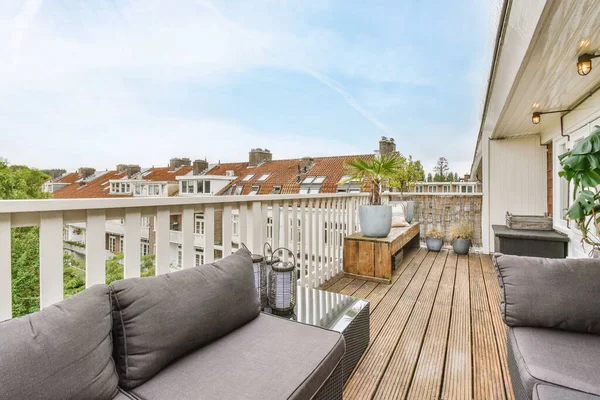 Luxurious balcony with gray sofa — Fotografia de Stock
