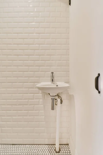 Adorable washbasin with white tiled walls — Photo