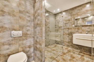 Amazing bathroom with brown tiles