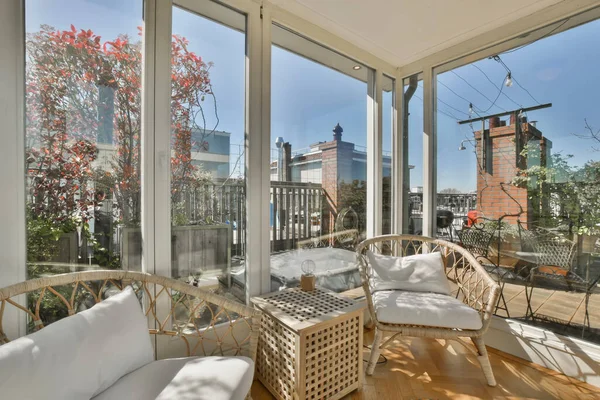 Cozy covered veranda with panoramic windows — Stock Photo, Image