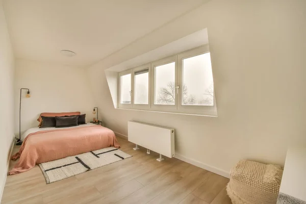 Spacious white bedroom in a minimalist style — Stock Photo, Image