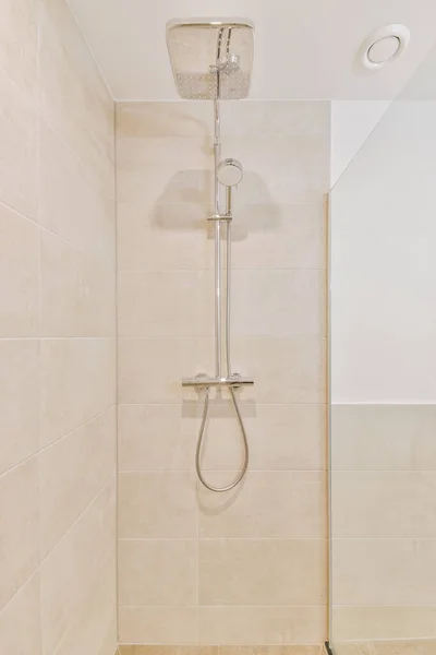 Bathroom interior finished with beige tiles — Stock Photo, Image