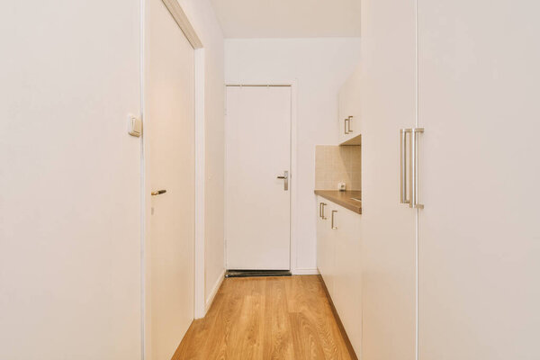 A spacious, bright corridor of a cozy house