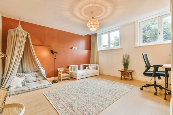 A spacious childrens room with a cot and a small tent — Fotografia de Stock