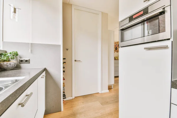 Narrow kitchen interior in modern apartment — Stockfoto
