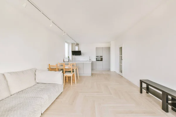 Corner of modern kitchen with living room — Fotografia de Stock