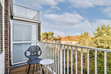 Small modern balcony with white door