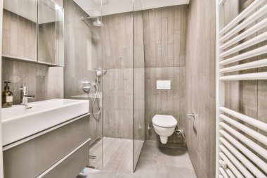 Modern bathroom in gray tones with appropriate equipment