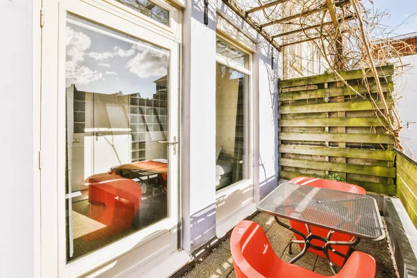 A small old-fashioned balcony with a wooden fence — Stok fotoğraf