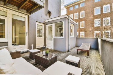 A small cozy terrace with wooden floors