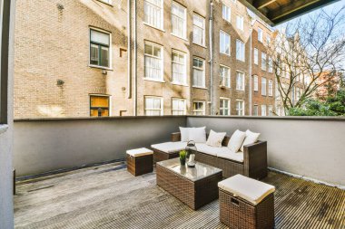 A small cozy terrace with wooden floors