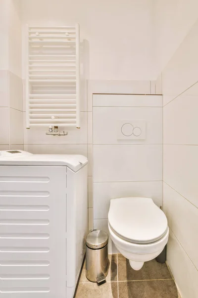 The interior of a modern bathroom with a ceramic toilet — Stok fotoğraf