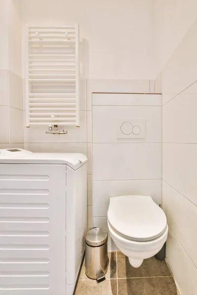 The interior of a modern bathroom with a ceramic toilet — 스톡 사진