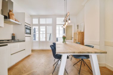 Kitchen in a modern house with white cabinets