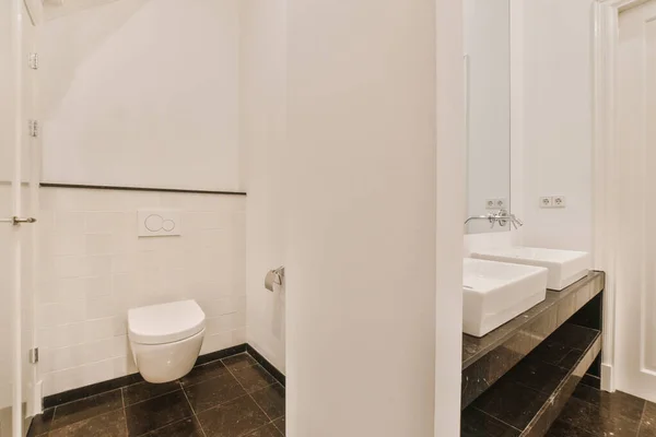 Lavatory with toilet and sink — Stock Photo, Image