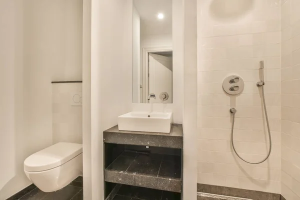 Lavatory with shower box,toilet and sink — Stock Photo, Image