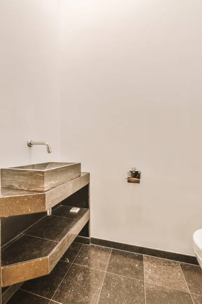 Simple toilet with small sink — Stock Photo, Image