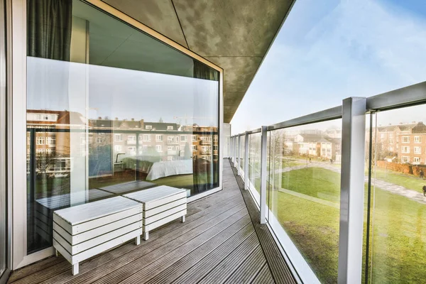 Outside view from a house balcony with glass lattice