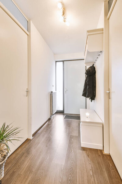 Bright entry hall with a shelf for clothes
