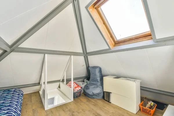 Spacious bright attic room for work and relaxation with a beautiful view from the window