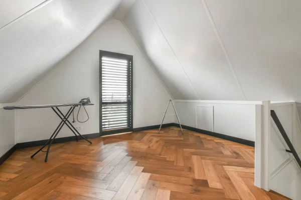 Spacious bright attic room for work and relaxation with a beautiful view from the window