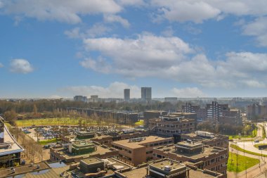 Panoramic view of high rise buildings and trees from height