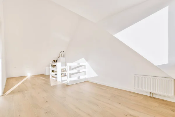 White hallway with wooden stairway leading to second floor of modern luxury apartment with minimalist interior design