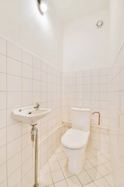 Interior Narrow Restroom Sink Wall Hung Toilet White Walls Checkered — Stock Photo, Image