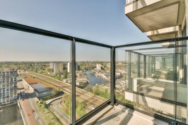 Sitting area in balcony with comfortable furniture around beautiful view