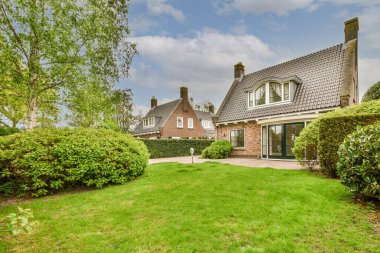 Neat powerful patio with sitting area and small garden