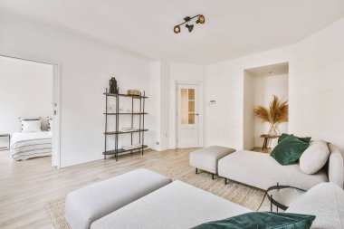 Interior design of modern minimalist style living room with large windows and wooden couch and cabinet