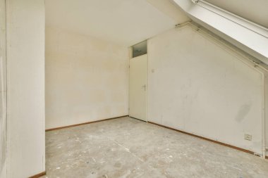 A cozy and spacious mansard styled empty room