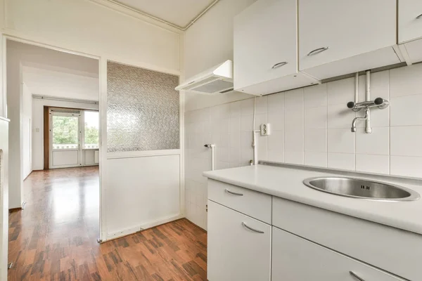 Well organized small home kitchen in urban apartment