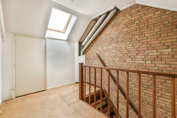 Interior of spacious apartment room on attic of building