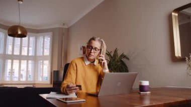 caucasian female working from home having business call with clients 