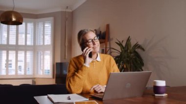 Caucasian business woman working from home on business call