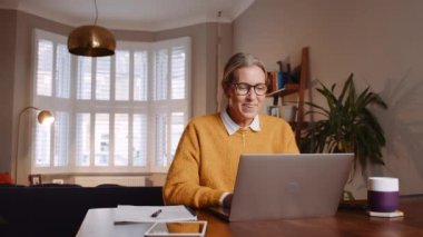 caucasian female working from home engaging in video call